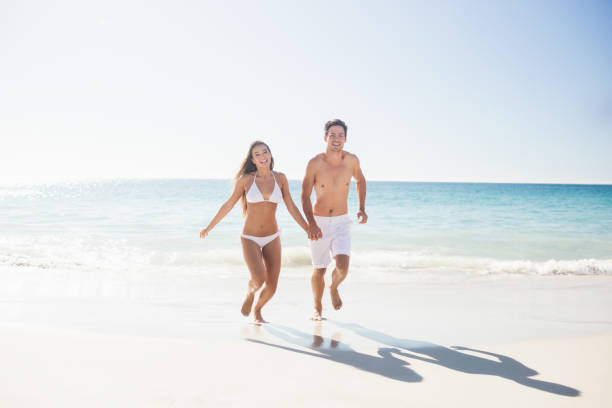 istock Couple having fun at the beach 663226814