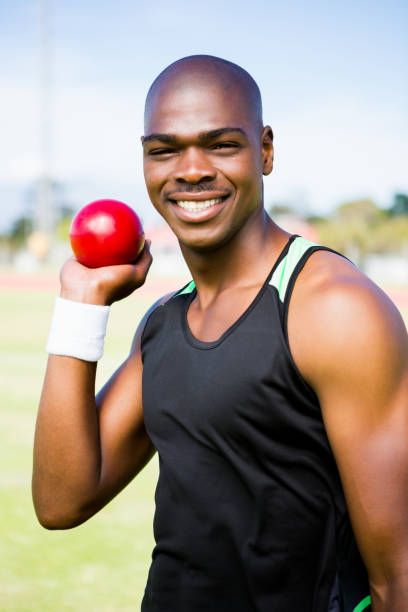 istock Male athlete preparing to throw shot put ball 663227314
