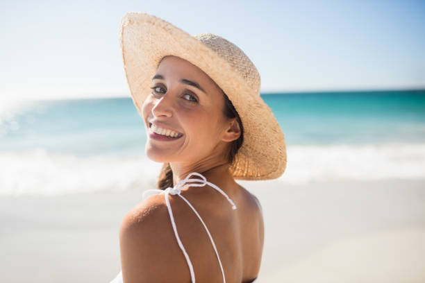 istock Happy woman posing on the beach 663245222