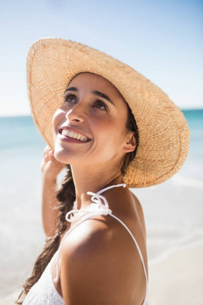istock Happy woman posing on the beach 663246192