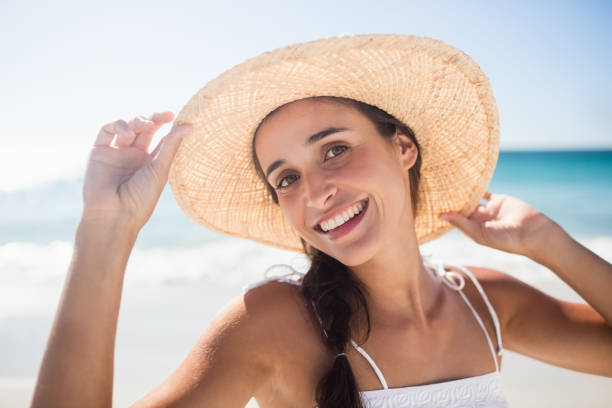 istock Happy woman posing on the beach 663246822