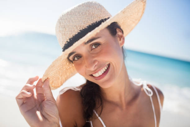 istock Happy woman posing on the beach 663247406