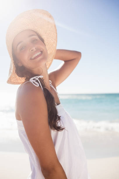 istock Happy woman posing on the beach 663249470