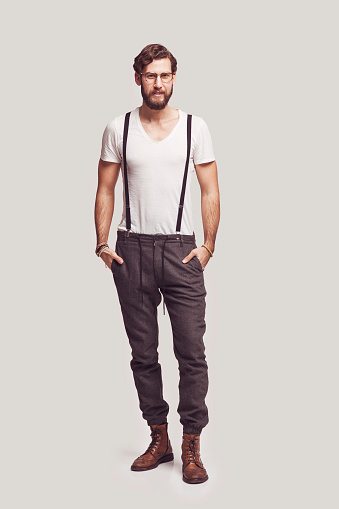 Young stylish hipster man standing
