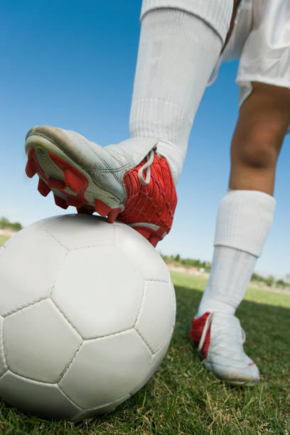 istock Soccer Player With Leg On Ball 663259764