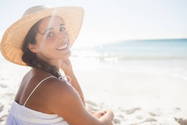 istock Happy woman posing on the beach 663260404
