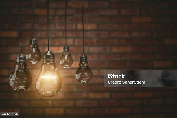 Teamwork Concept Vintage Bulbs On Brick Wall Background Copy Space For Text3d Rendering Stock Photo - Download Image Now