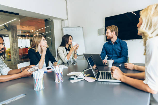 istock Colleagues sitting at office desk and brainstorming 663262524