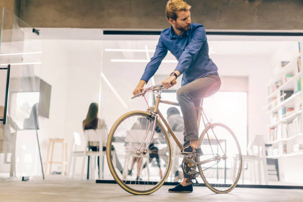 istock Businessman riding a bicycle to work 663262562