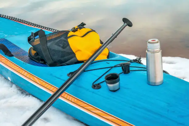 a hot tea stop during winter stand up paddling workout