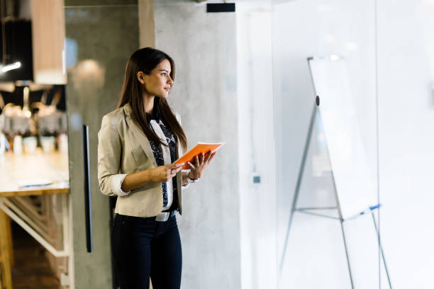 istock Businesswoman holding and reading document 663268426