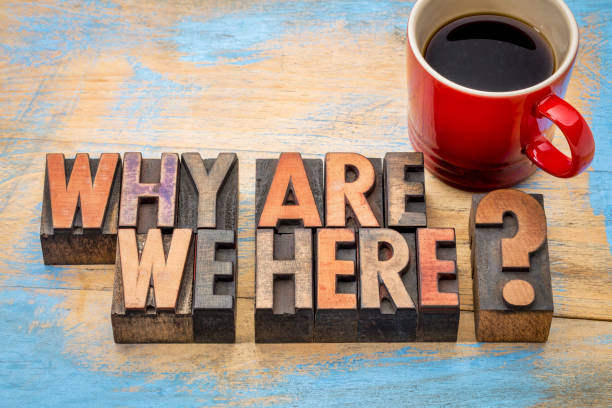 Why are we here question Why are we here? A philosophical and spiritual question in vintage letterpress wood type with a cup of coffee printing block photos stock pictures, royalty-free photos & images