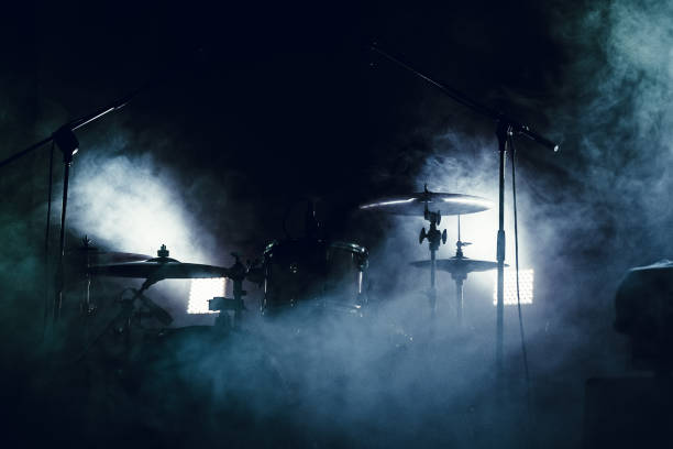 Drum set in smoke on a stage stock photo