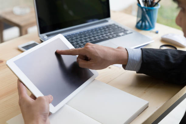 istock businessman watching something on digital tablet in office 663272252