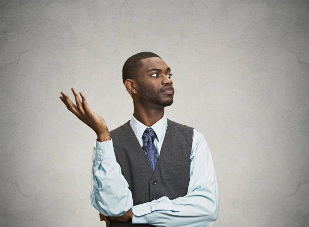 istock dumb clueless young executive man, arm out asking why 663280606