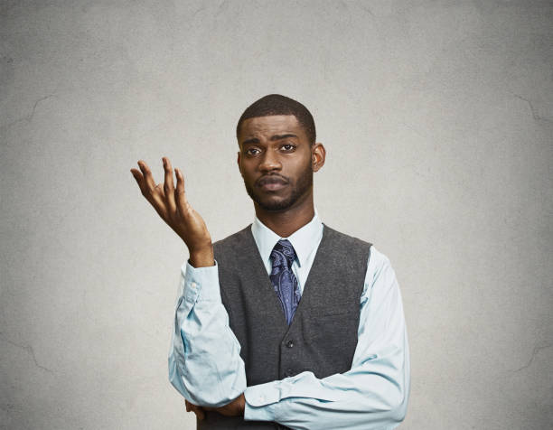 istock dumb clueless young executive man, arm out asking why what problem so who cares 663280624