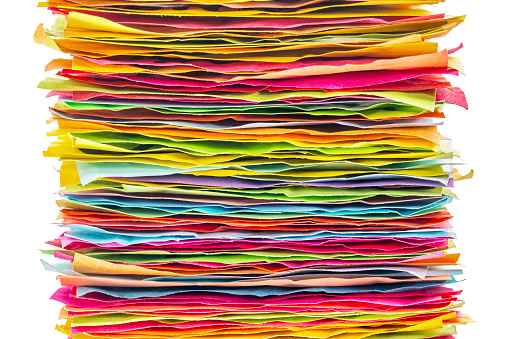 stack of colorful sticky notes - side view against white background