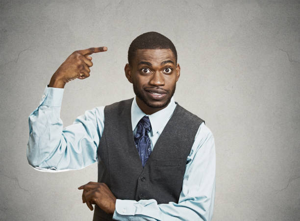 istock rude, difficult, angry young executive businessman gesturing with fingers against temple 663280812