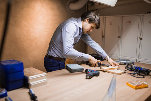 istock Handyman working with wood with precision tools at hand 663299896