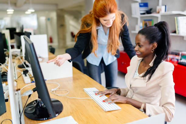 istock Business people collaborate in office and work on computer 663302842