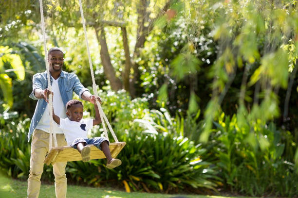 istock Happy family doing swing 663325316