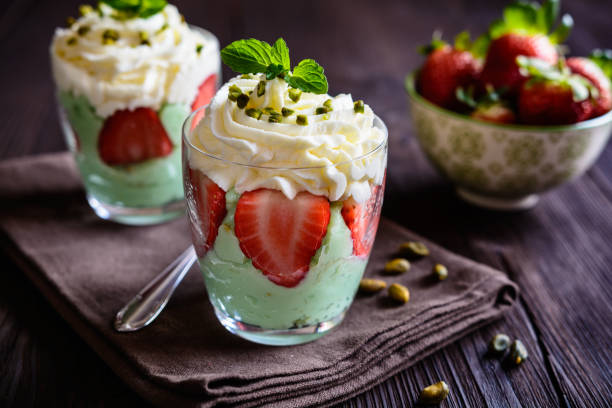 istock Pistachio pudding with strawberries and whipped cream 663331610