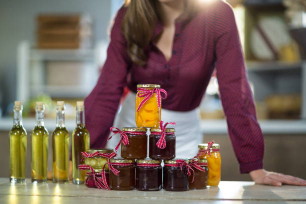 istock Olive oil, jam, pickle placed together on table 663333684