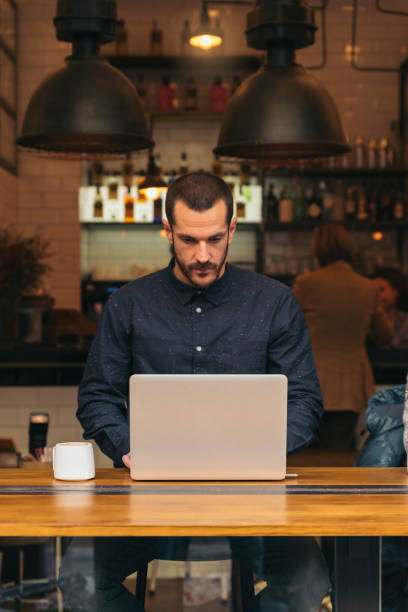 istock Businessman using his laptop in the Coffee Shop. 663351870