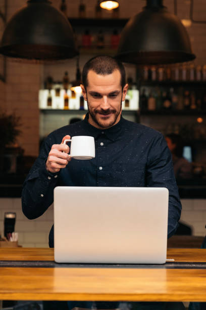 istock Businessman using his laptop in the Coffee Shop. 663352032