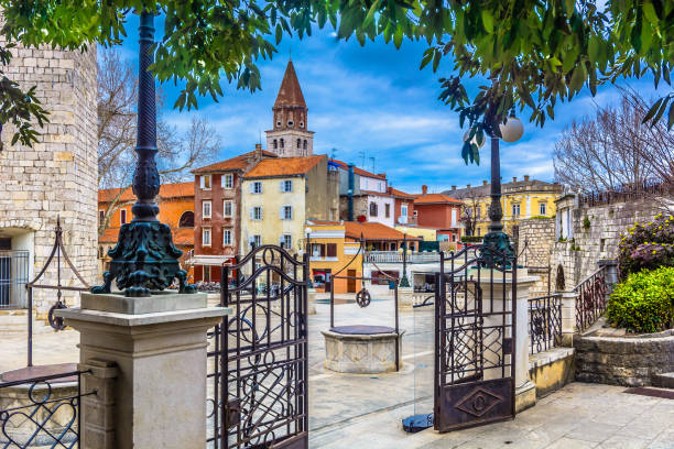 Ancient square in city center of Zadar, Croatia. Marble architecture at Zadar town, view at old roman public square with ancient five wells as a symbol of town, Croatia - european travel places. croatian culture photos stock pictures, royalty-free photos & images