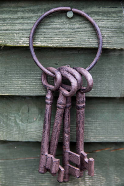 istock Vintage old keys hanging up 663361542
