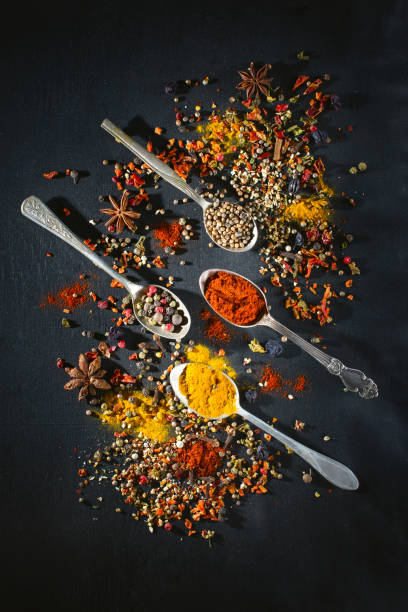 istock Spoons with spices seasoning on chalk board 663374308