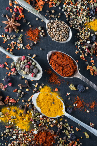 istock Spoons with spices seasoning on chalk board 663376102