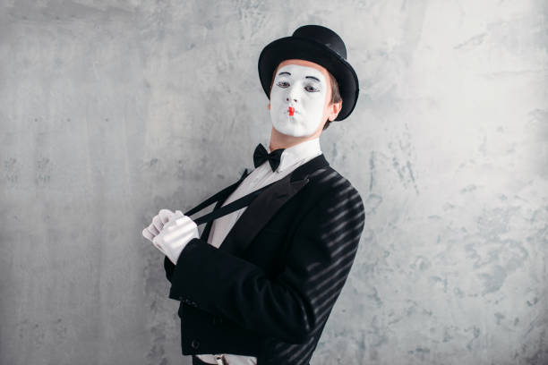 istock Mime male artist with white makeup mask 663376164