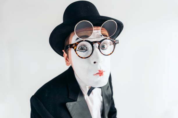istock Pantomime actor face in glasses and makeup mask 663383026
