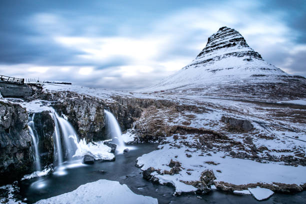 Mountain and waterfalls - Mount Kirkjufell Iceland Mountain and waterfalls - Mount Kirkjufell Iceland. kirkjufell stock pictures, royalty-free photos & images