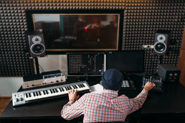 istock Sound producer work with audio equipment in studio 663393788