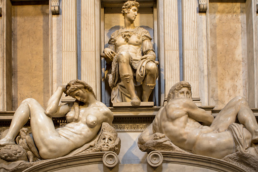 Tomb of Giuliano de Medici and below lying on the sarcophagus  Michelangelo's sculptures 'Night and Day'