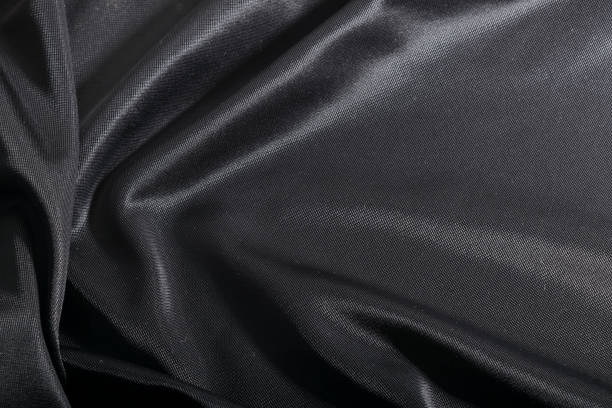 mode elegant dunklen stoff, schwarz textilhintergrund. - lycra stock-fotos und bilder