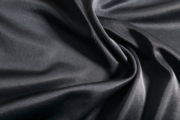 istock Luxurious elegant dark fabric, black textile background. 663423820