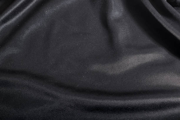 istock Luxurious elegant dark fabric, black textile background. 663423844