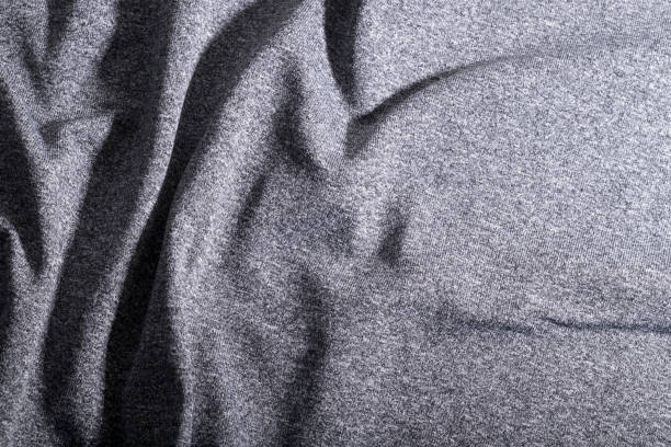 Abstract elegant light grey fabric, gray textile background.
