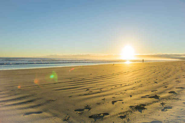 istock Sunrise over wide flat sandy beach at Ohope Whakatane 663481432