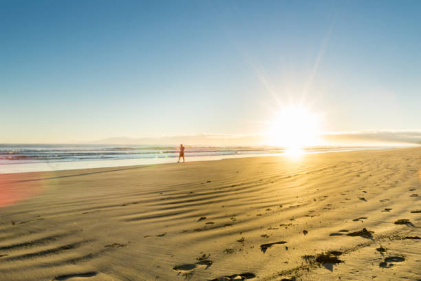 istock Sunrise over wide flat sandy beach at Ohope Whakatane 663481650