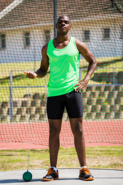 istock Portrait of athlete holding hammer throw 663483948