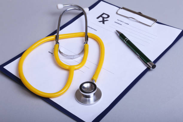 istock RX prescription, Red heart and a stethoscope on white background 663504414
