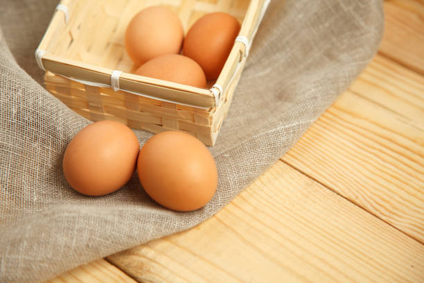 istock Chicken Egg on wooden rustic background -View from the top 663510320