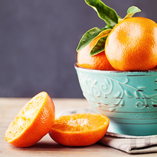 istock Juicy Mandarin Fruit in a Bowl on Background 663515798