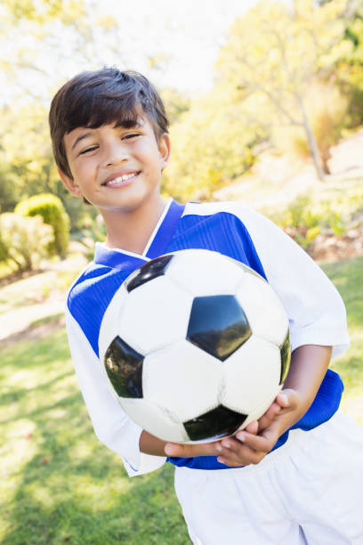 istock front view of little boy balloon holding balloon 663531016