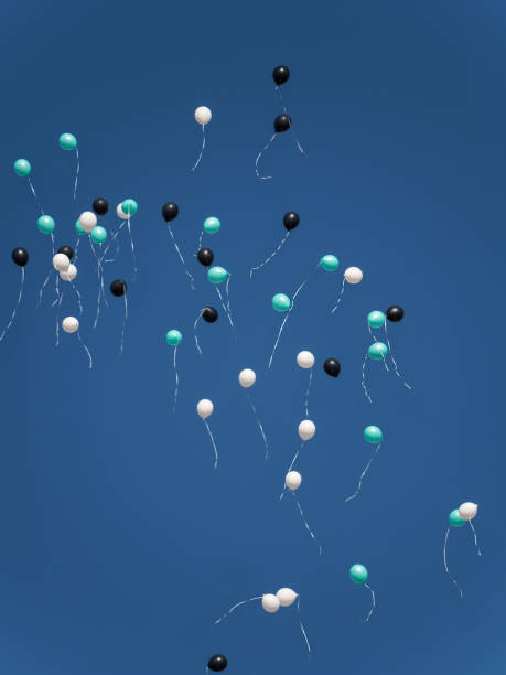 istock Many balloons fly into the blue sky 663531434